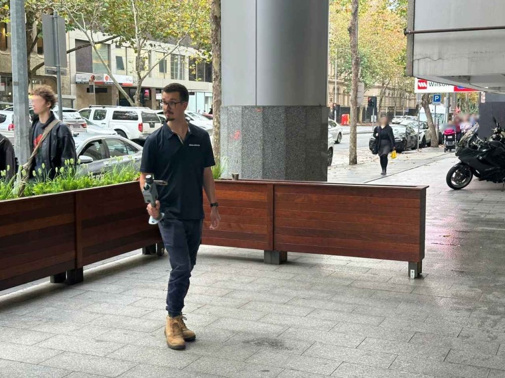 James Realserve Melbourne using a XGrid Hand Held SLAM technology to capture an outdoor seating area for a marketing floor plan