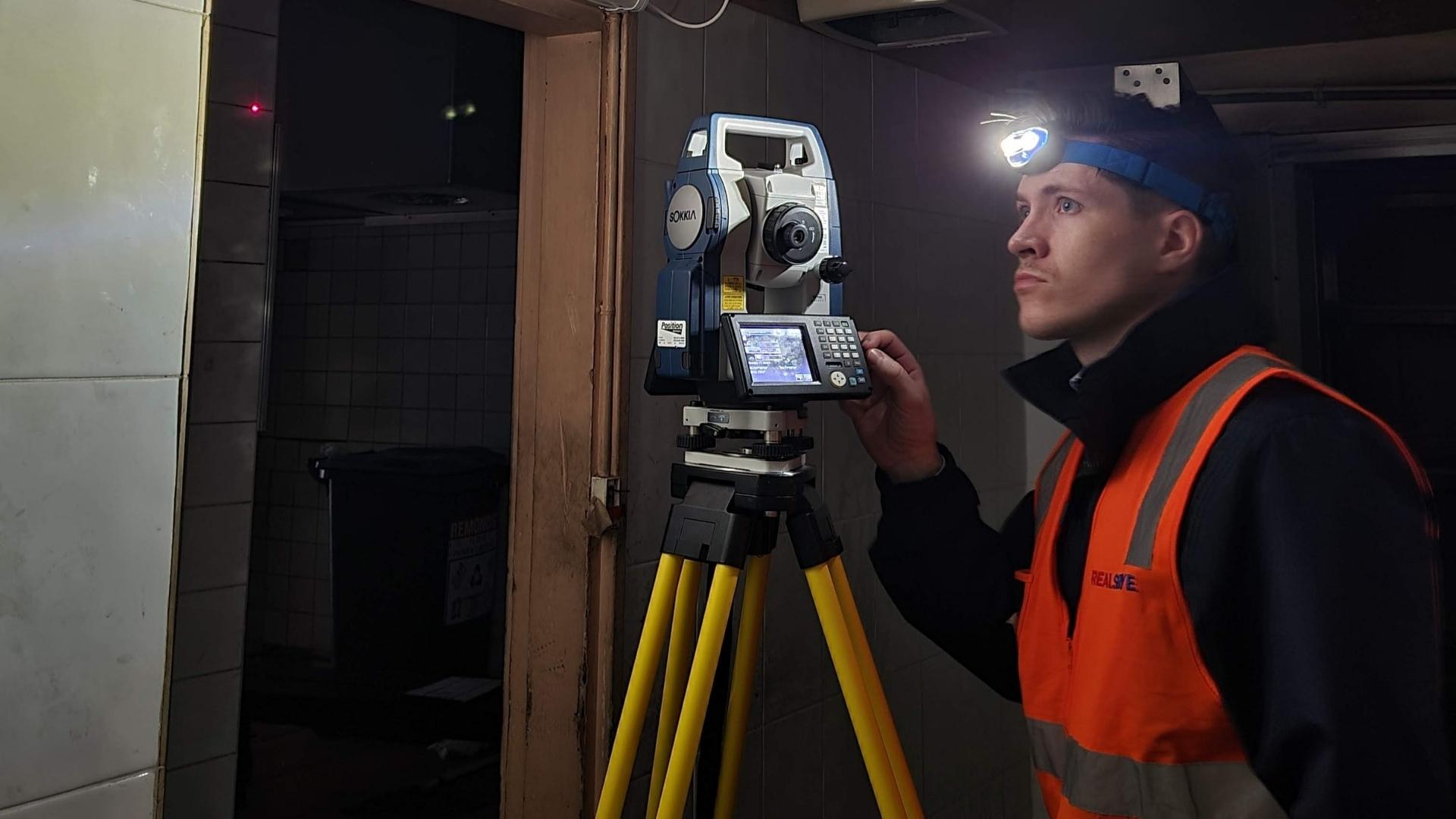 Surveyor doing 3D scanning for a new building